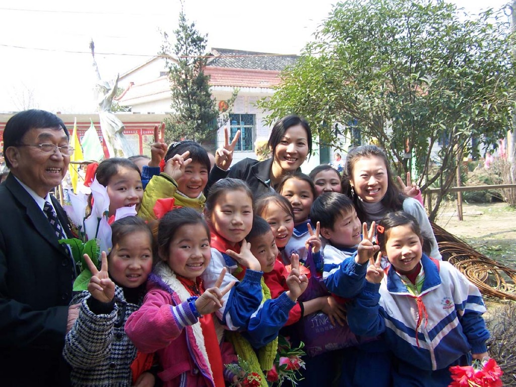 Jewelry designer Jessica Fong with the children at her school